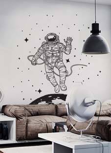 Дизайнерская наклейка на стену Космонавт в открытом космосе